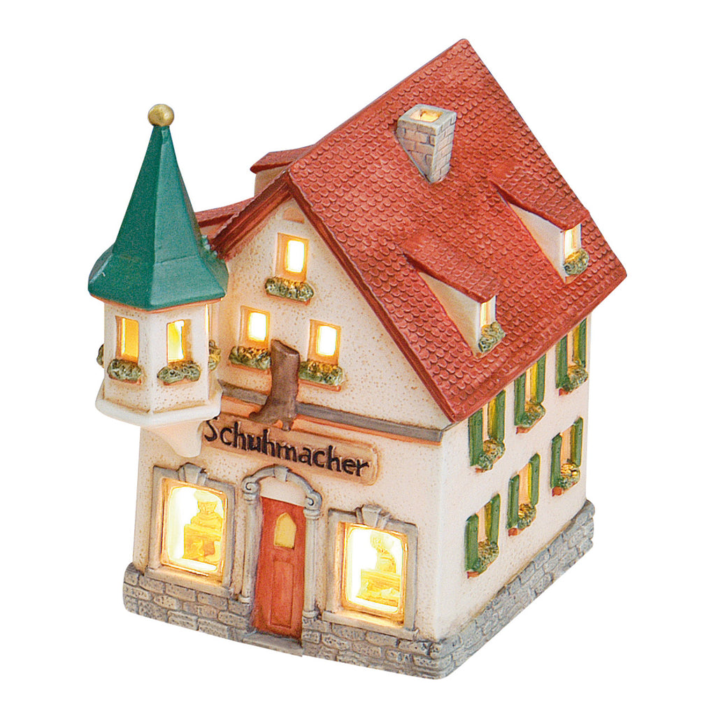 Porcelanowy domek świąteczny – pracownia szewca 17 cm